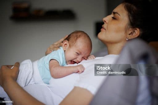 Postpartum mother with newborn
